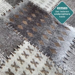 patchwork koeienhuid kleed grijs