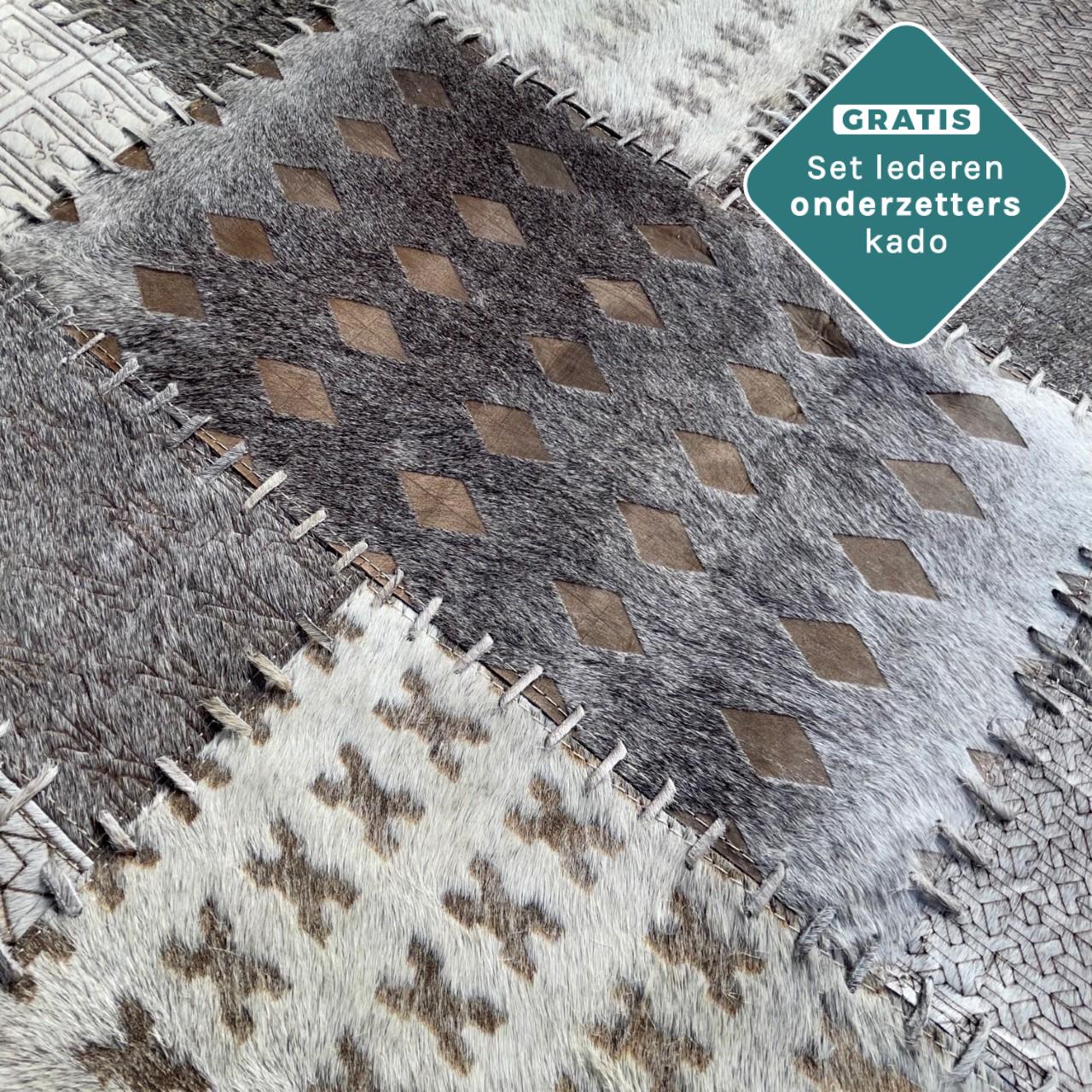 patchwork koeienhuid kleed grijs
